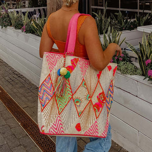 woman carrying oversized tote bag