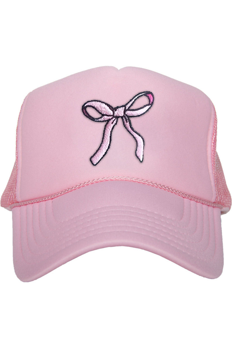 A pink foam hat with a pink ribbon on it