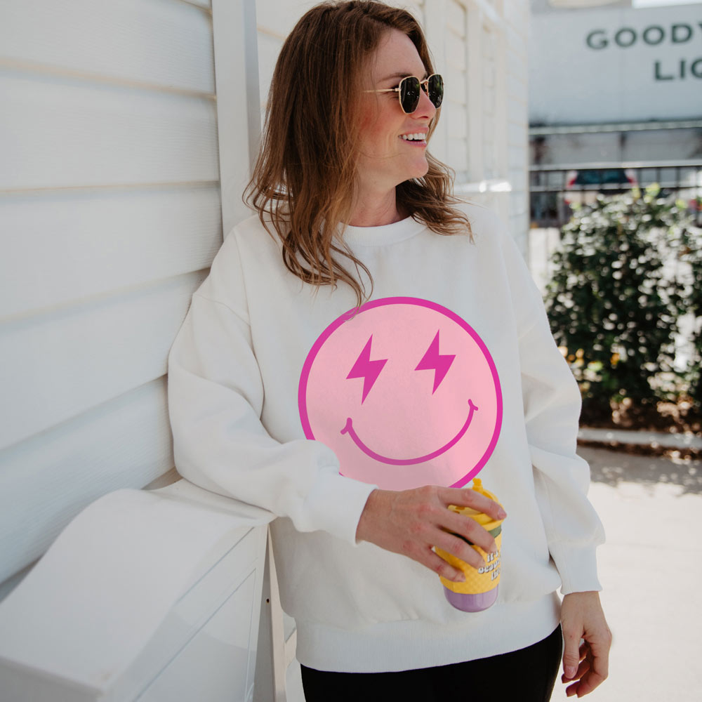 https://www.katydidwholesale.com/cdn/shop/products/graphic-sweater-smiley-face-spark-white_2048x.jpg?v=1684865626