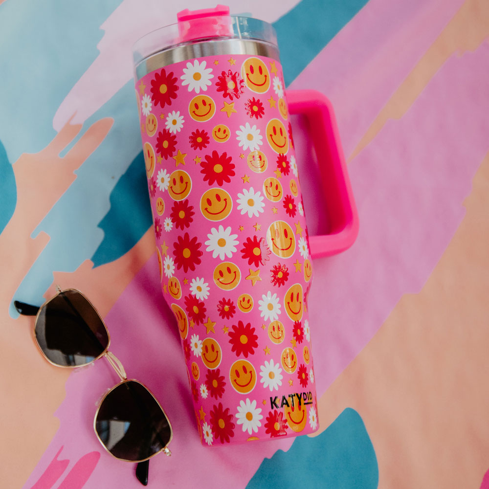 https://www.katydidwholesale.com/cdn/shop/products/stainless-steel-tumbler-smiley-face-hot-pink-floral_2048x.jpg?v=1699998921